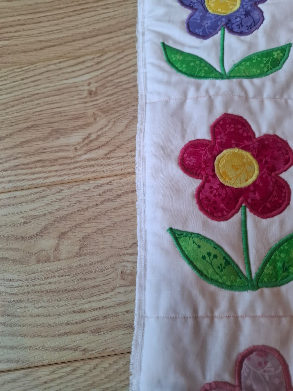Close-up of machine appliqué stitching on a flower