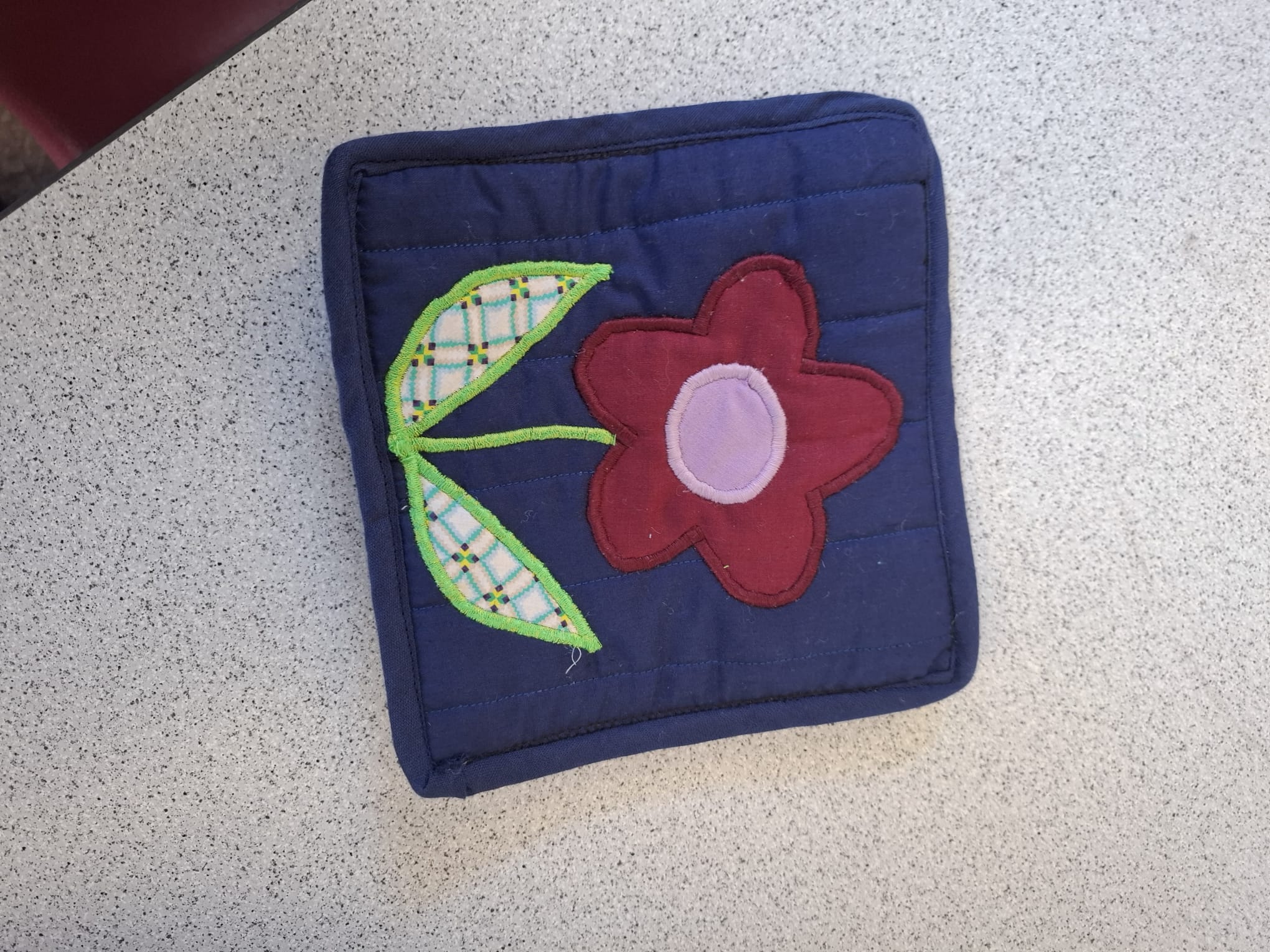 A single appliqué flower panel from the blanket