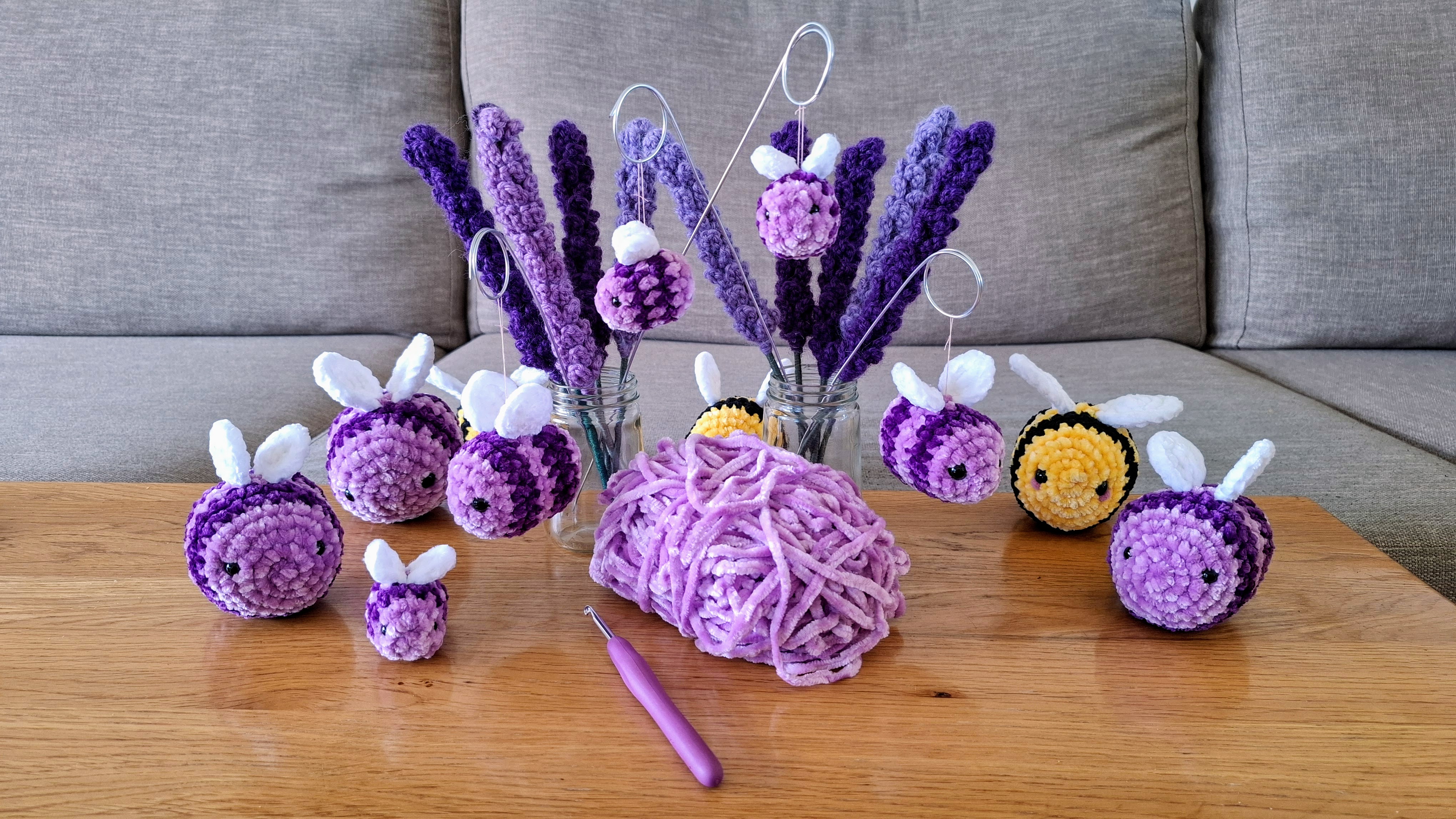 Crocheted lavender stems in jars surrounded by purple and yellow bees