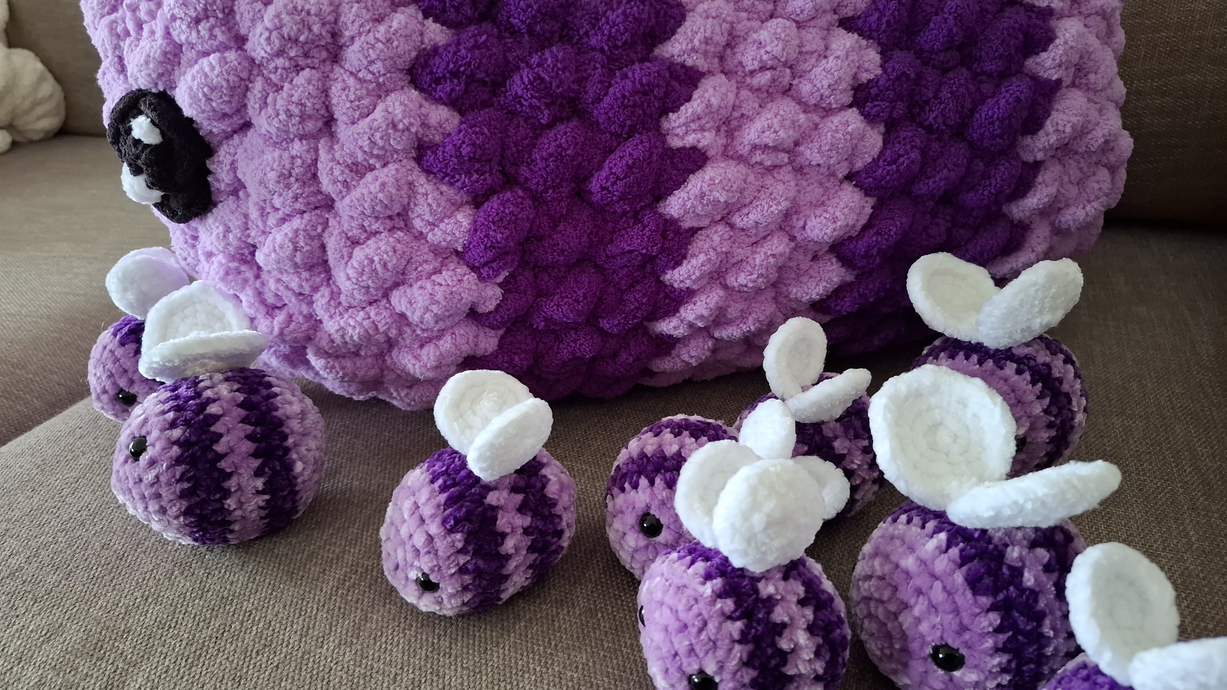 Close-up of the giant crocheted purple bee